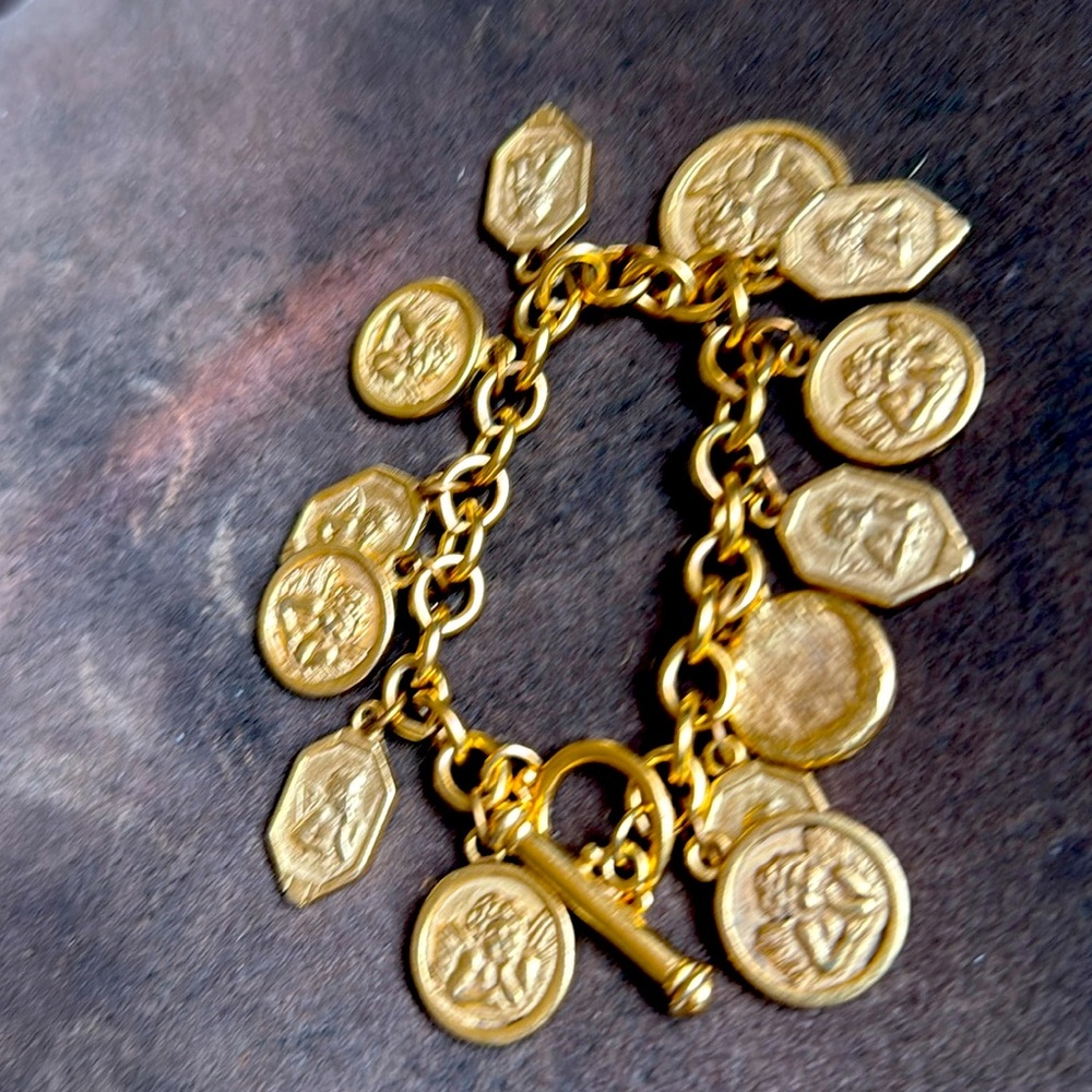 Gold bracelet with angel coins very nice bracelet